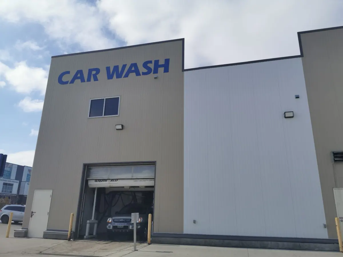 Blue 8 Bay Car Wash sign in front of Arctic Autowash on Stony Plain Road, Edmonton