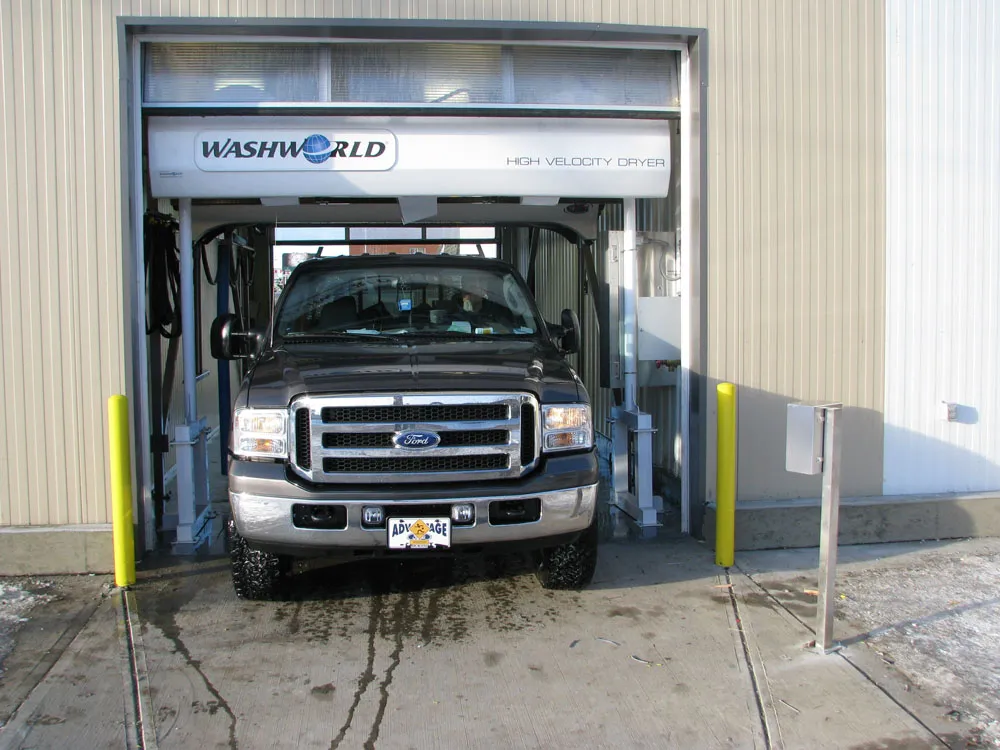 Truck leaving the high velocity dryer at the Arctic Autowash touchless car wash in Edmonton