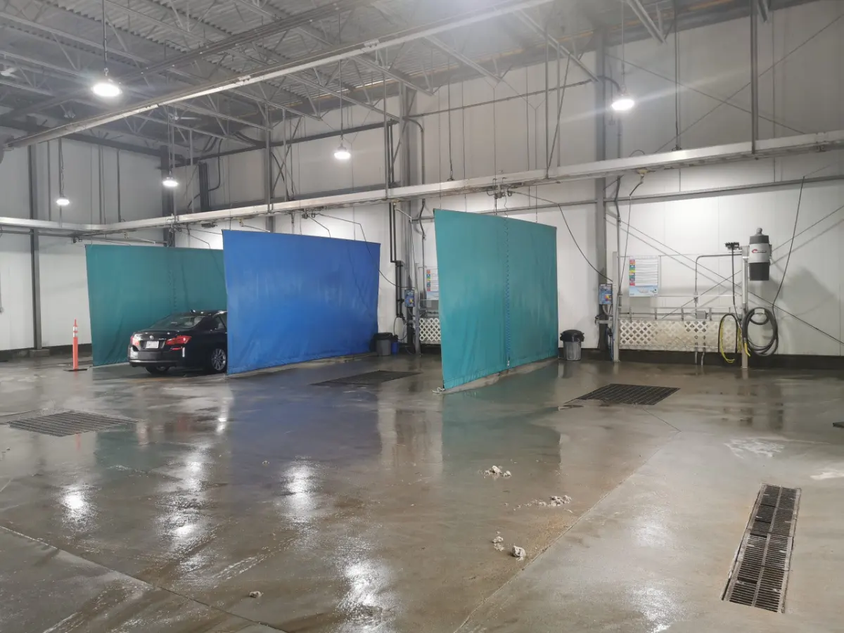 Wide heated wand wash bays inside Arctic Autowash in Edmonton
